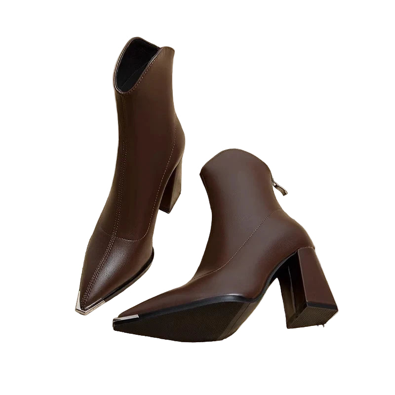 Brown ankle boots on a newspaper background