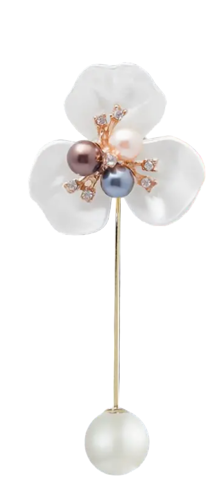Decorative hairpin with white flower design and pearls on a dark background